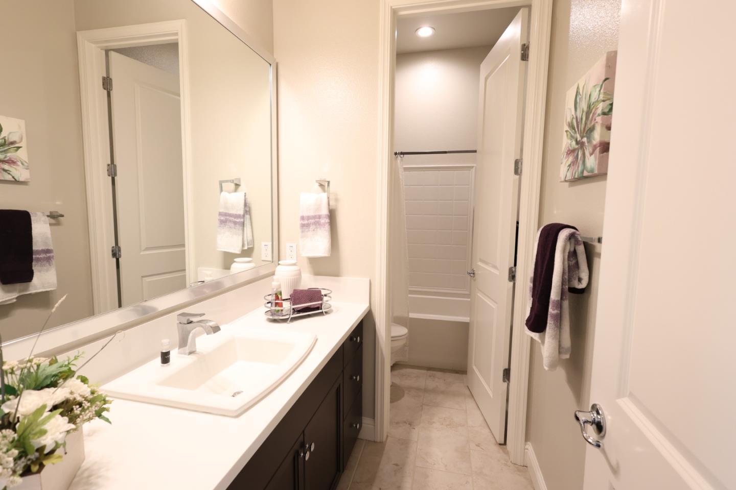 478 Logan Way Marina, CA 93933 - Photo 41 of 42 a bathroom with a sink vanity and a mirror