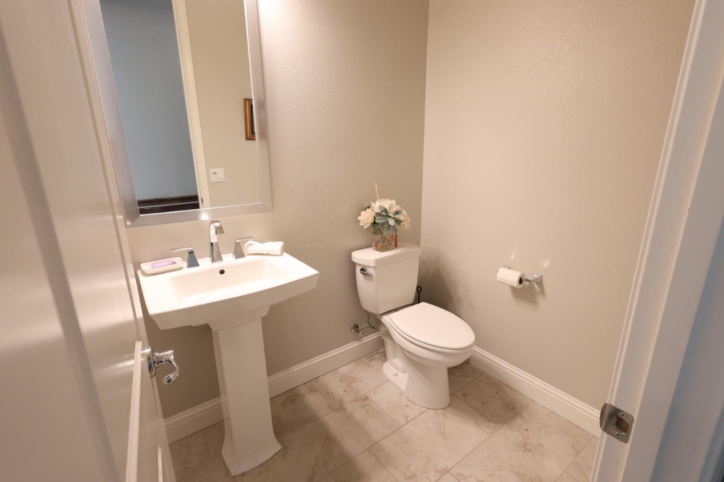 478 Logan Way Marina, CA 93933 - Photo 42 of 42 a bathroom with a toilet sink and mirror