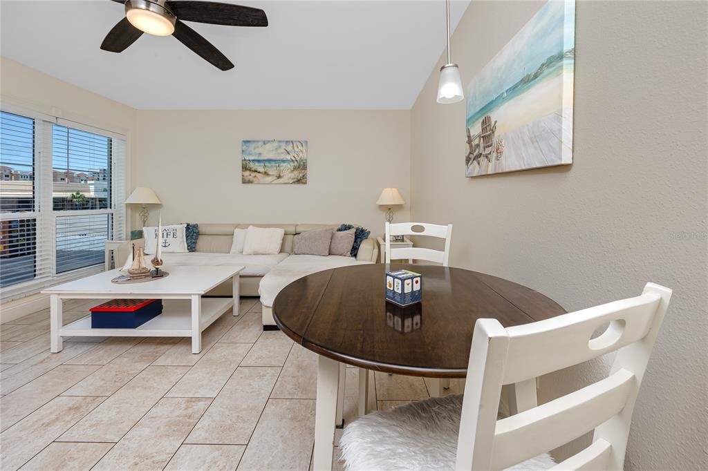 159 Medallion Boulevard, Unit F Madeira Beach, FL 33708 - Photo 16 of 47 a living room with furniture