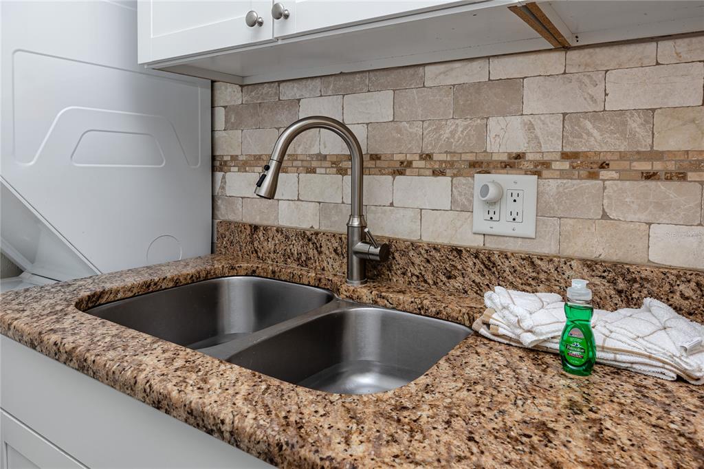 159 Medallion Boulevard, Unit F Madeira Beach, FL 33708 - Photo 21 of 47 a close view of sink and tap