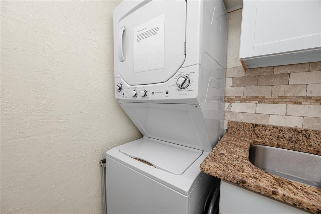 159 Medallion Boulevard, Unit F Madeira Beach, FL 33708 - Photo 31 of 47 a view of washer and dryer