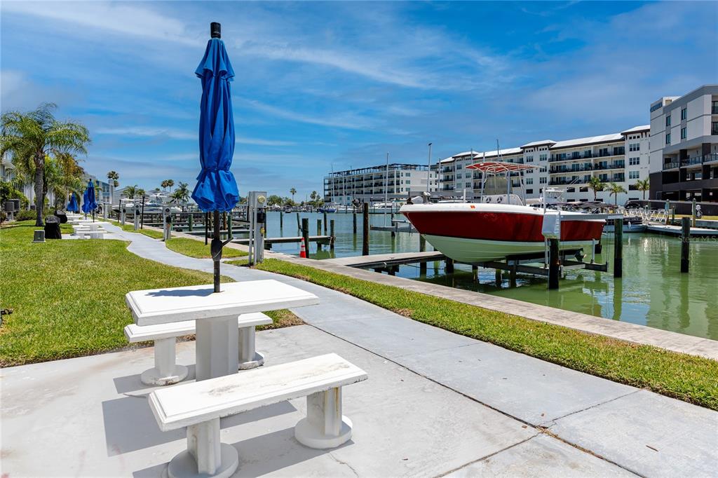 159 Medallion Boulevard, Unit F Madeira Beach, FL 33708 - Photo 32 of 47 a front view of a city with tall buildings