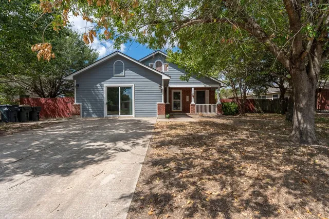 a house with a tree in front of it