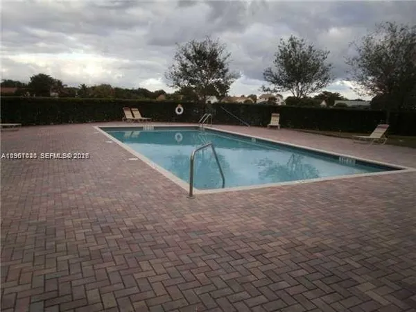 a view of a swimming pool with a lake view