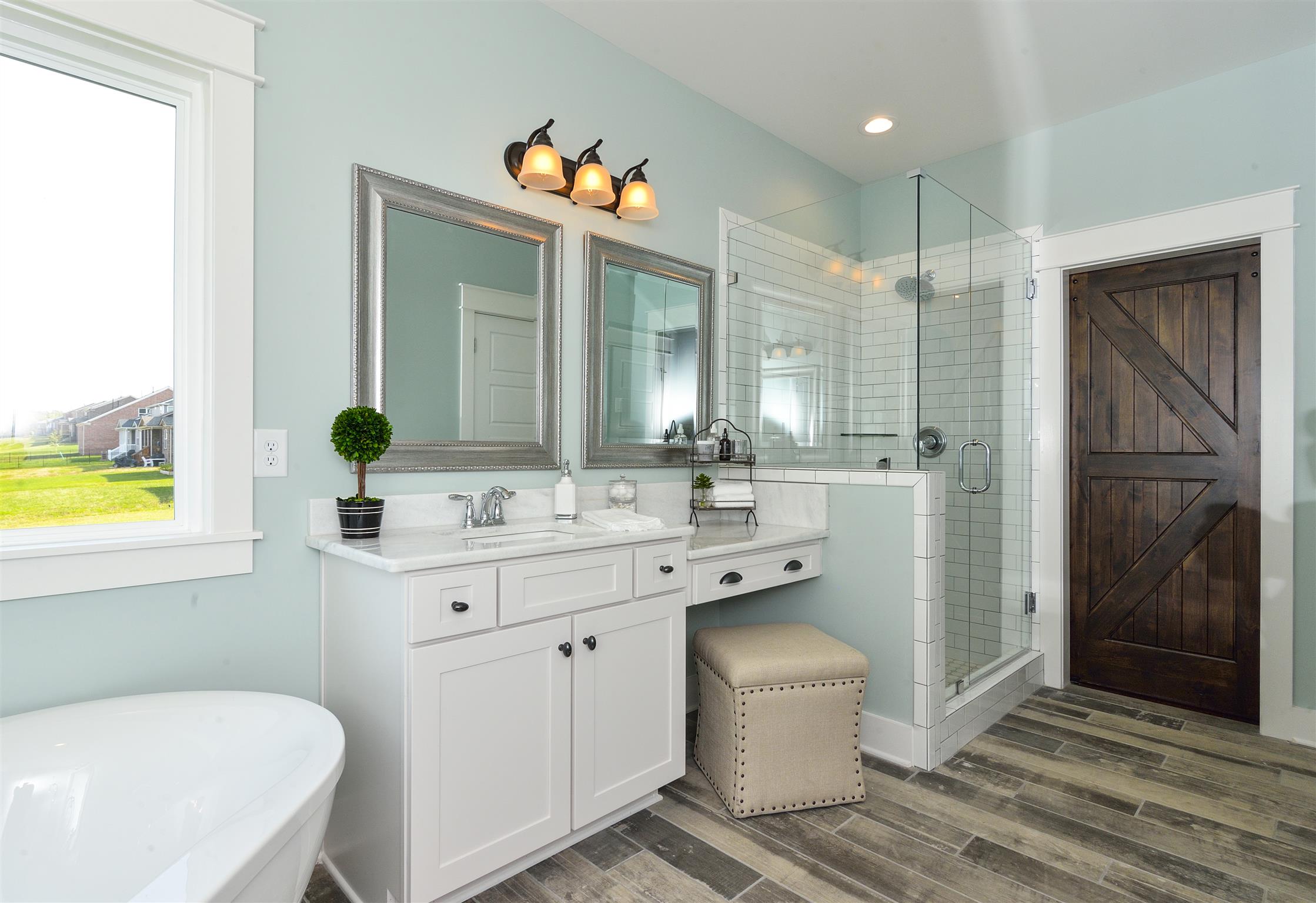 87 Truman Road East Franklin, TN 37064 - Photo 20 of 23 Large vanity area looking into shower with frameless glass.