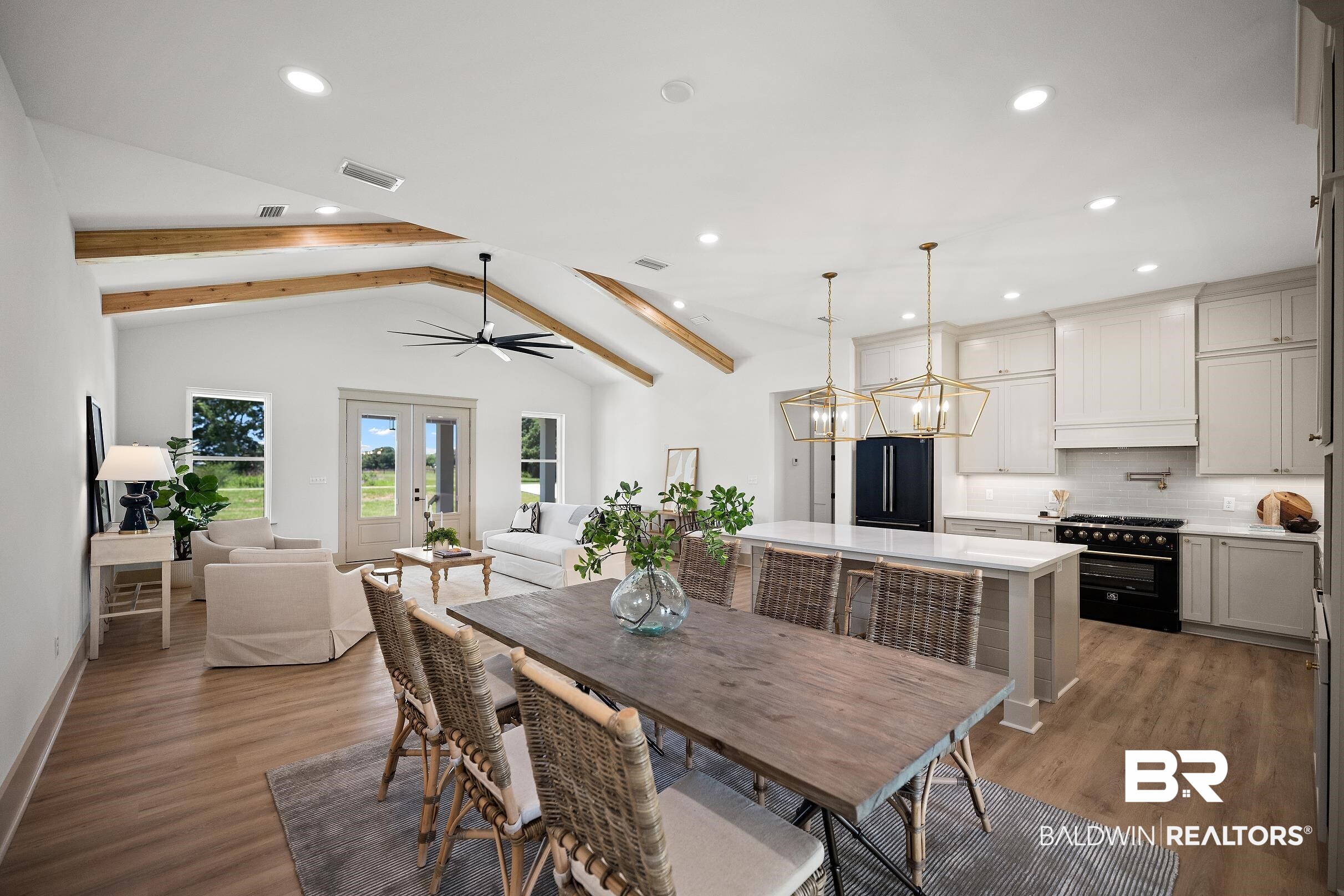 13111 Gopher Court Elberta, AL 36530 - Photo 8 of 41 Open-concept living space featuring vaulted ceilings with exposed wood beams, recessed lighting, and wood-finish flooring