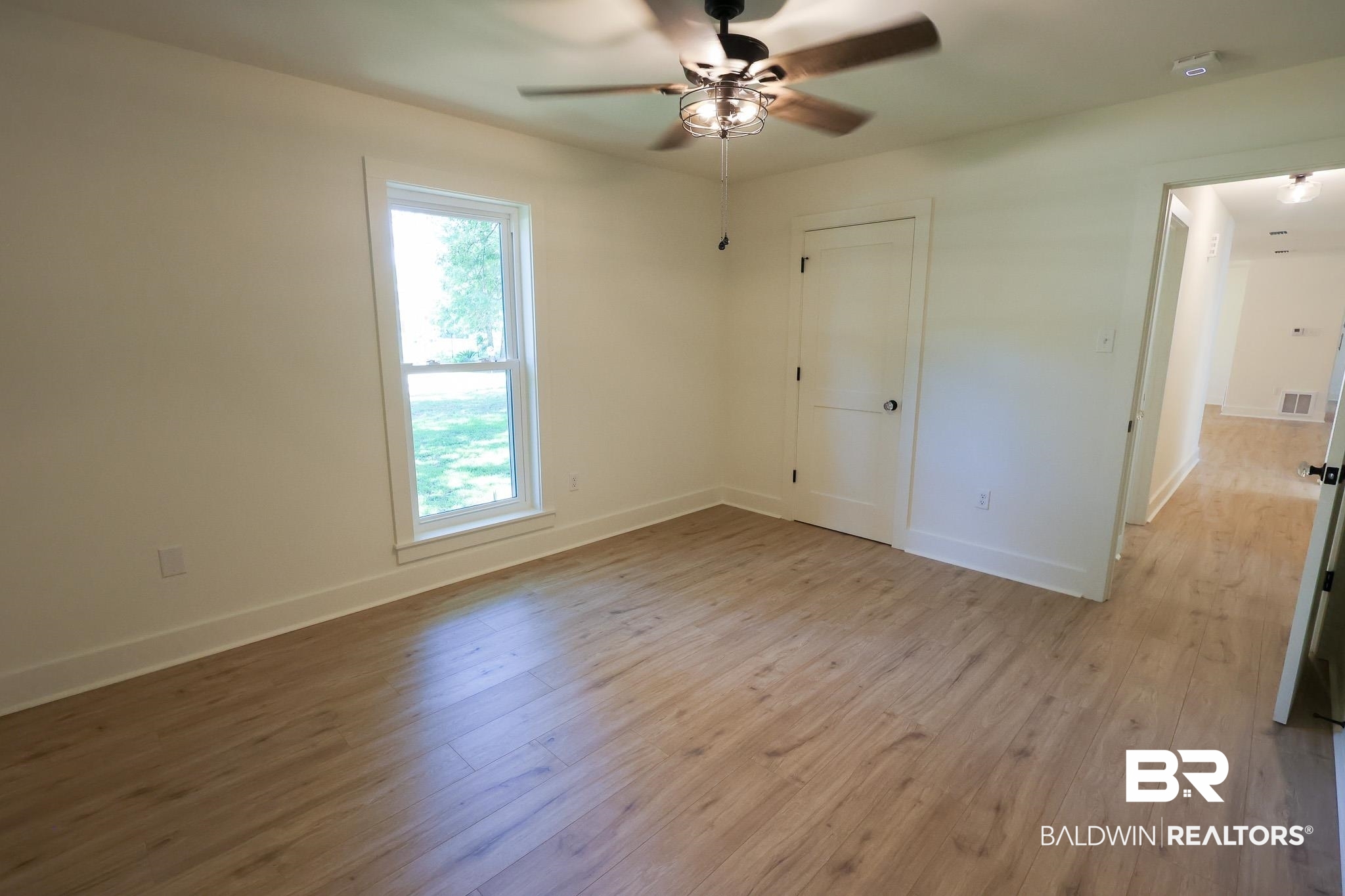12190 Pecan Grove Street Magnolia Springs, AL 36555 - Photo 19 of 45 Empty room with hardwood / wood-style flooring and ceiling fan