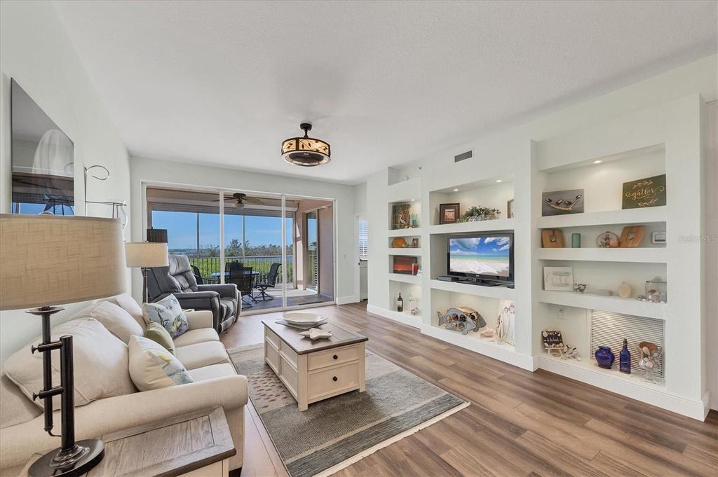 13313 Gasparilla Road, Unit 202 Placida, FL 33946 - Photo 11 of 57 a living room with furniture and a flat screen tv