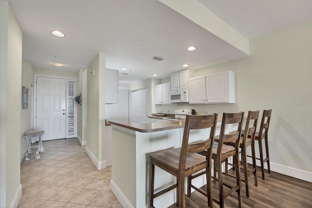 13313 Gasparilla Road, Unit 202 Placida, FL 33946 - Photo 14 of 57 a kitchen with a table and chairs in it