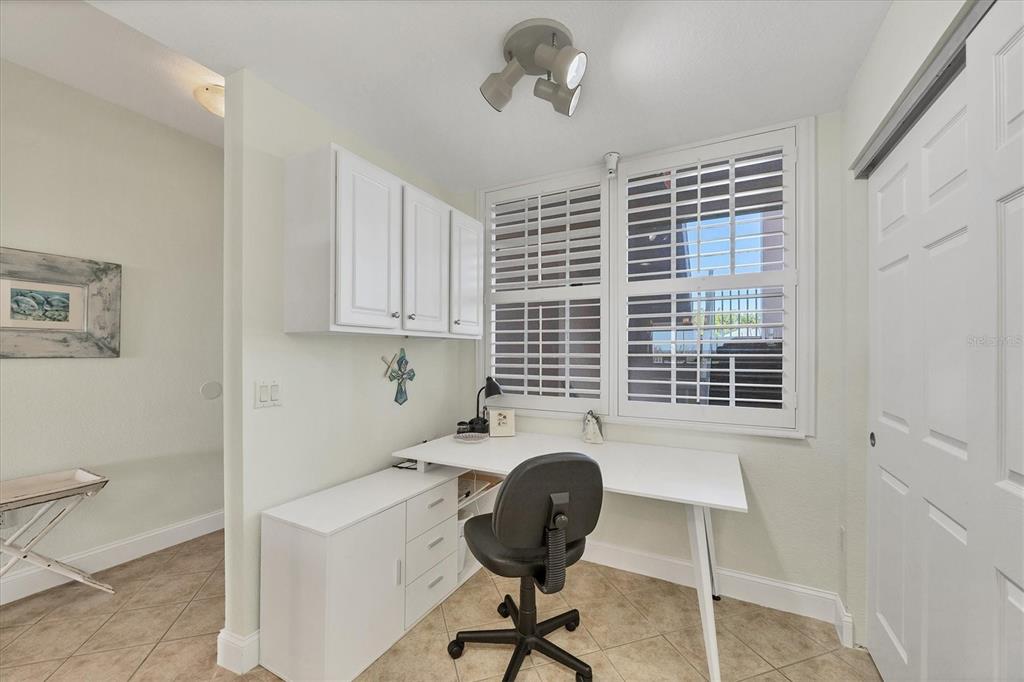 13313 Gasparilla Road, Unit C202 Placida, FL 33946 - Photo 19 of 49 a view of a workspace with furniture and a window
