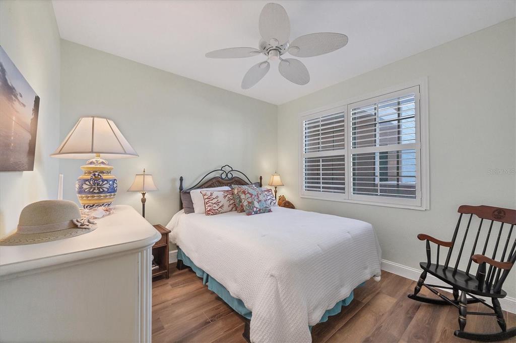 13313 Gasparilla Road, Unit 202 Placida, FL 33946 - Photo 30 of 57 a bedroom with a bed and a table in it