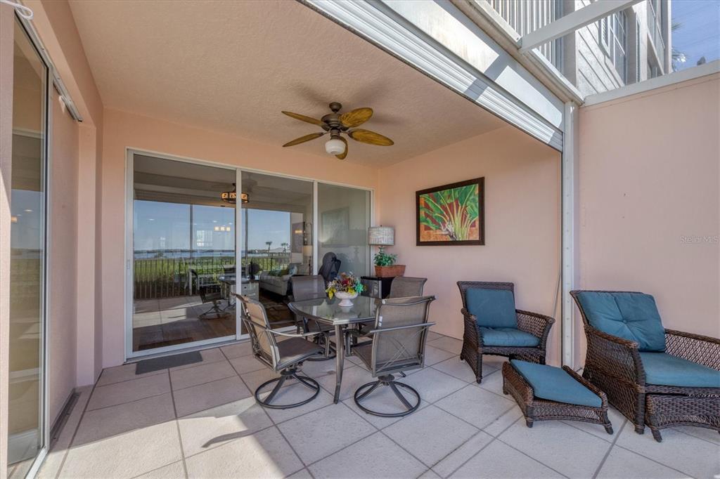 13313 Gasparilla Road, Unit C202 Placida, FL 33946 - Photo 32 of 49 a view of a livingroom with furniture and a ceiling fan