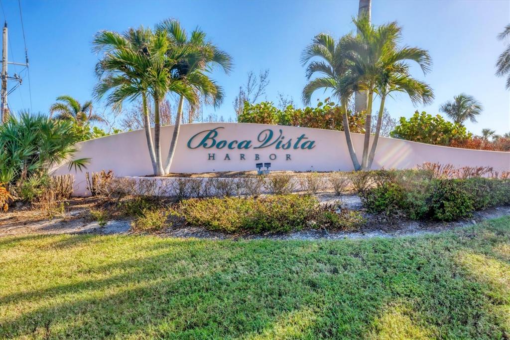 13313 Gasparilla Road, Unit C202 Placida, FL 33946 - Photo 36 of 49 a sign that is sitting in front of a house with a big yard