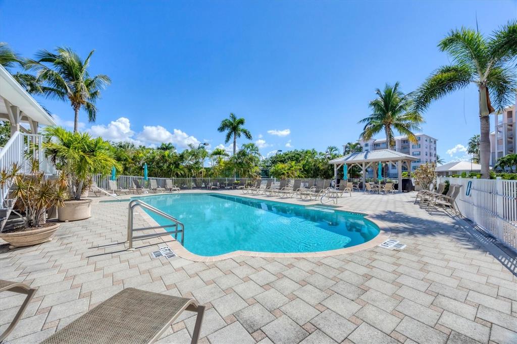 13313 Gasparilla Road, Unit C202 Placida, FL 33946 - Photo 39 of 49 a view of outdoor space yard and swimming pool