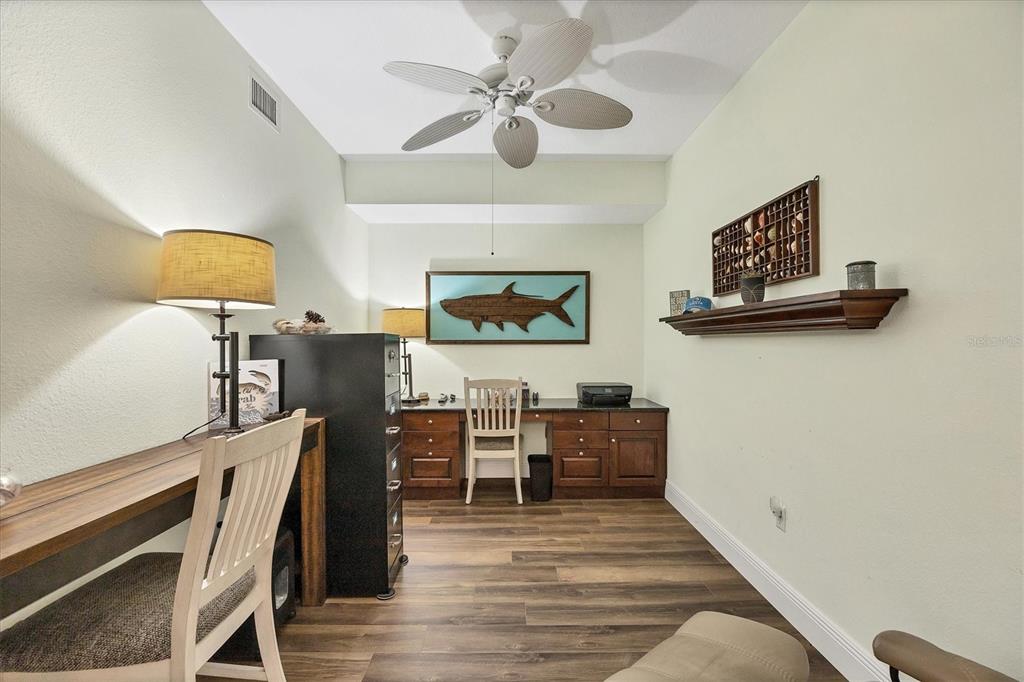 13313 Gasparilla Road, Unit C202 Placida, FL 33946 - Photo 7 of 49 a living room with furniture and a wooden floor