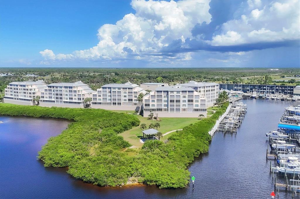 13313 Gasparilla Road, Unit C202 Placida, FL 33946 - Photo 8 of 49 a view of a lake with a city