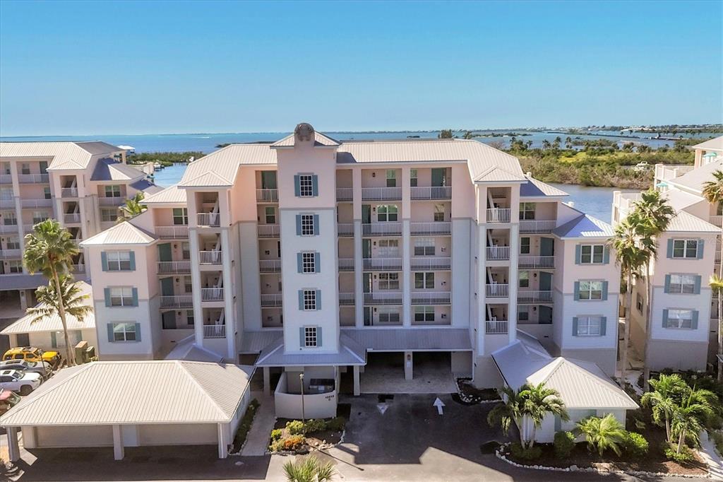 13313 Gasparilla Road, Unit C202 Placida, FL 33946 - Photo 9 of 49 a front view of a building with outdoor seating
