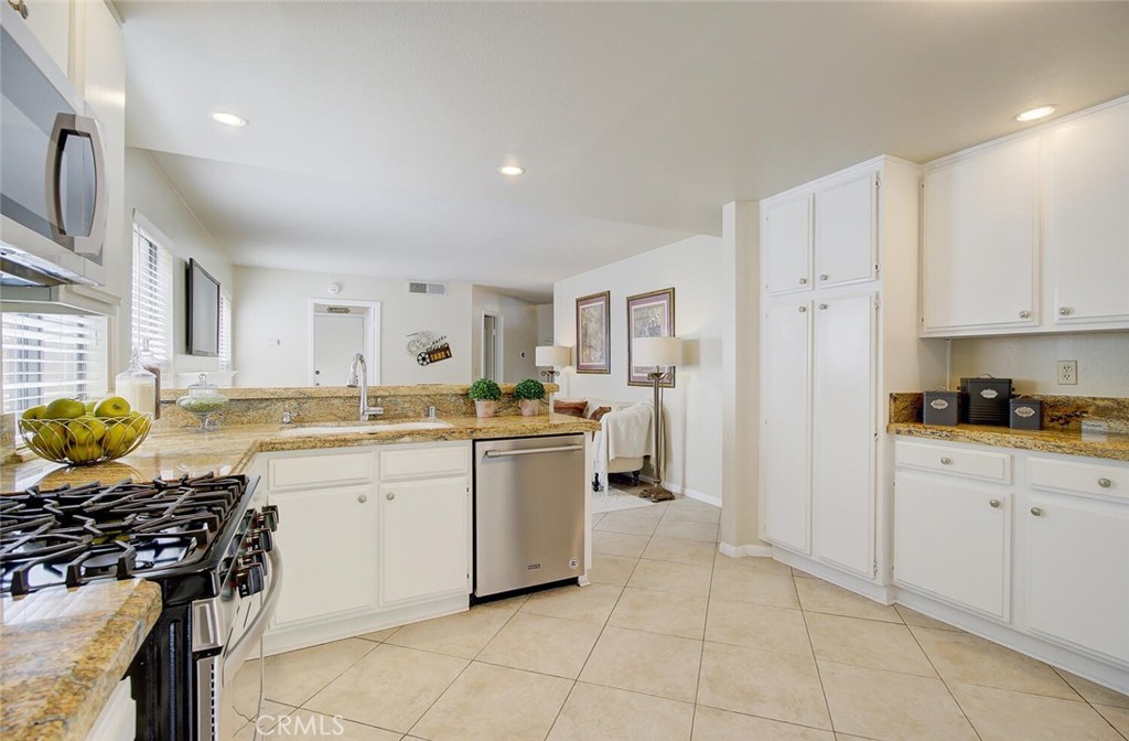 26809 Cold Springs Street Calabasas, CA 91301 - Photo 12 of 33 a kitchen with a stove a sink and a refrigerator