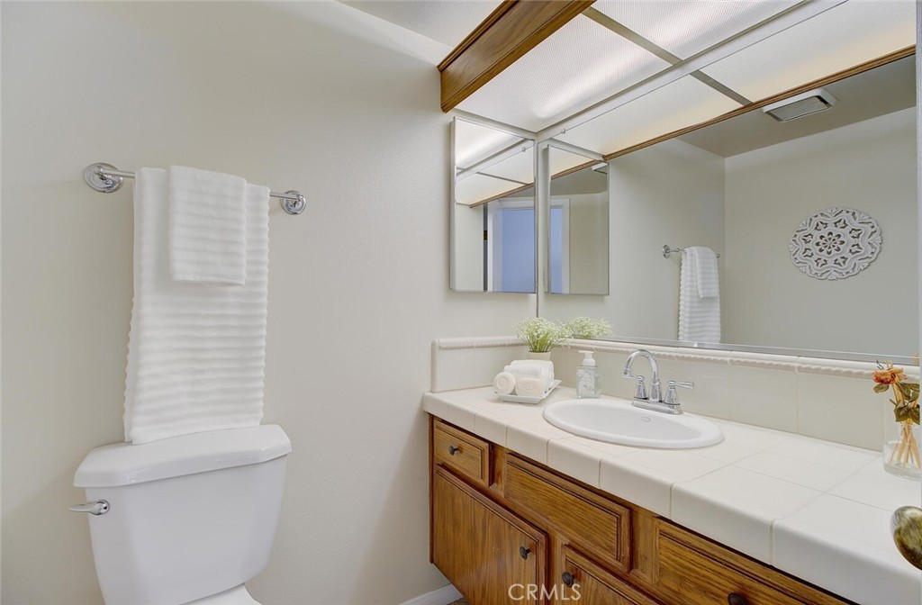26809 Cold Springs Street Calabasas, CA 91301 - Photo 18 of 33 a bathroom with a sink and a mirror