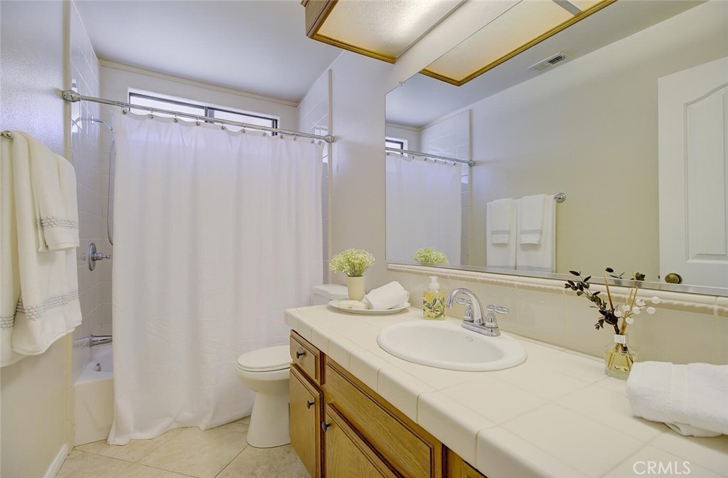 26809 Cold Springs Street Calabasas, CA 91301 - Photo 25 of 33 a bathroom with a double vanity sink toilet and shower
