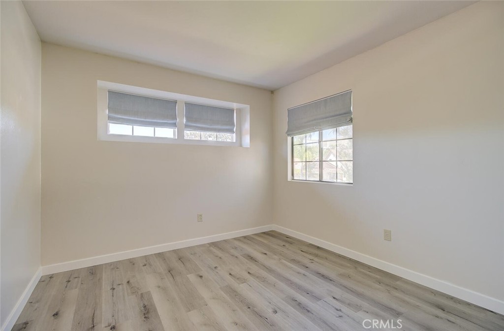 26809 Cold Springs Street Calabasas, CA 91301 - Photo 28 of 33 an empty room with wooden floor and windows