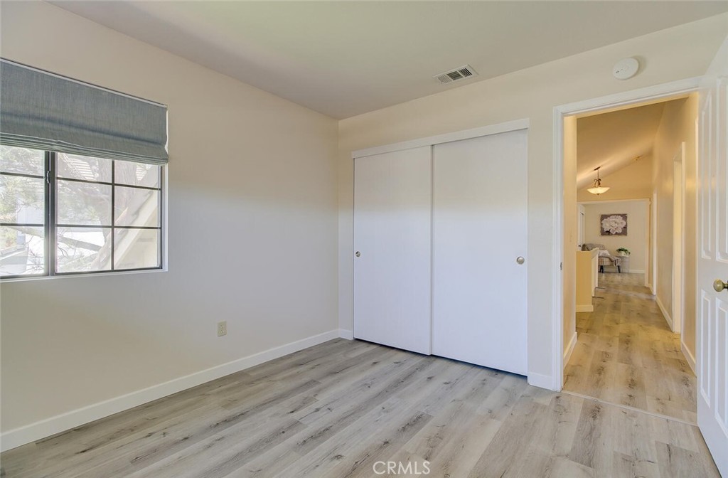 26809 Cold Springs Street Calabasas, CA 91301 - Photo 29 of 33 an empty room with wooden floor and windows