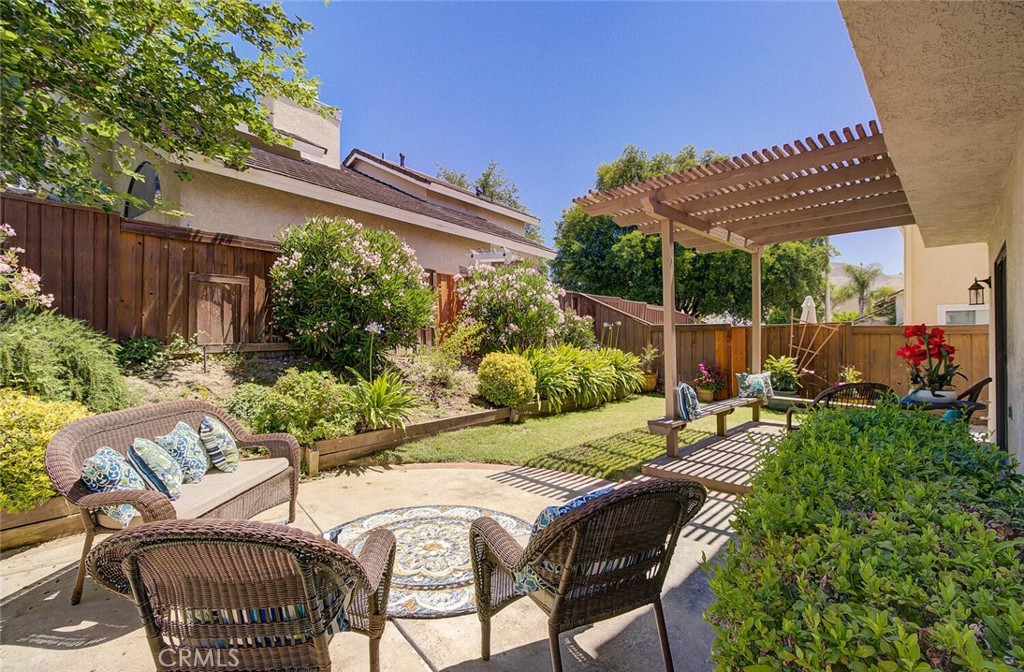 26809 Cold Springs Street Calabasas, CA 91301 - Photo 33 of 33 a view of a patio with table and chairs and potted plants