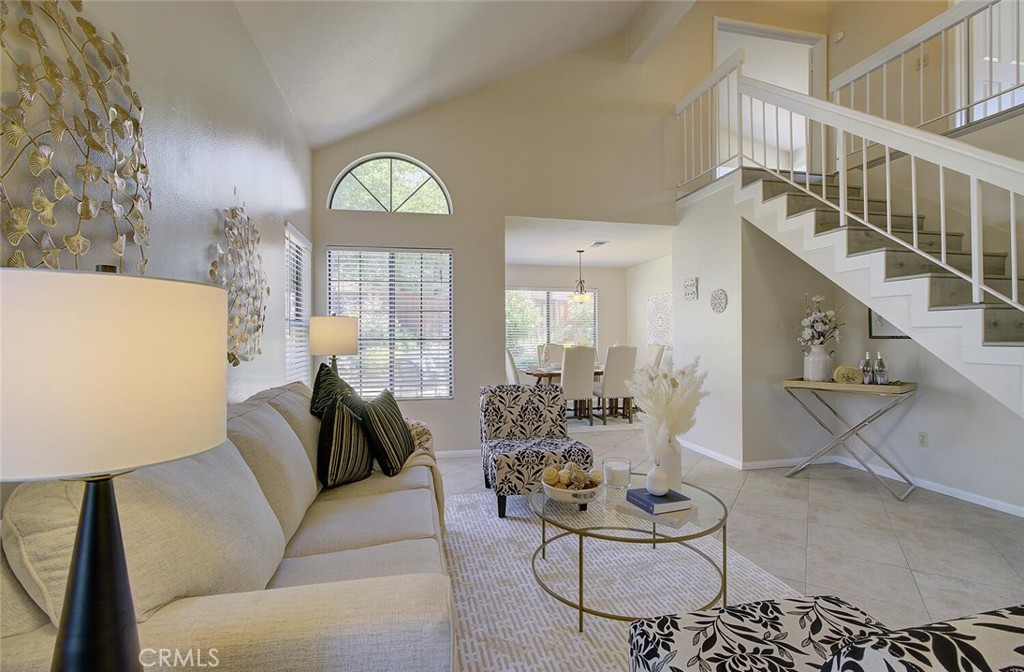 26809 Cold Springs Street Calabasas, CA 91301 - Photo 8 of 33 a living room with furniture a fireplace and a chandelier