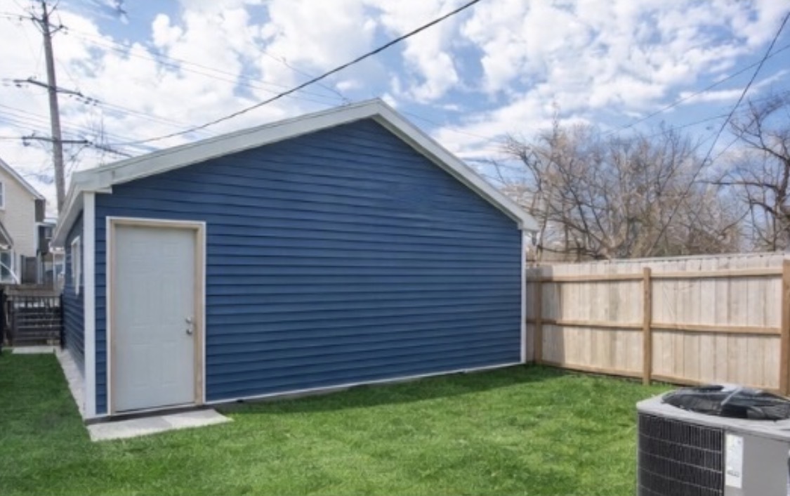 8810 South Morgan Street Chicago, IL 60620 - Photo 18 of 18 a view of backyard of house with wooden fence