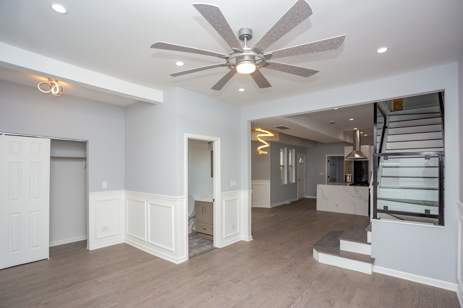 8810 South Morgan Street Chicago, IL 60620 - Photo 4 of 18 an entryway and a room with wooden floor