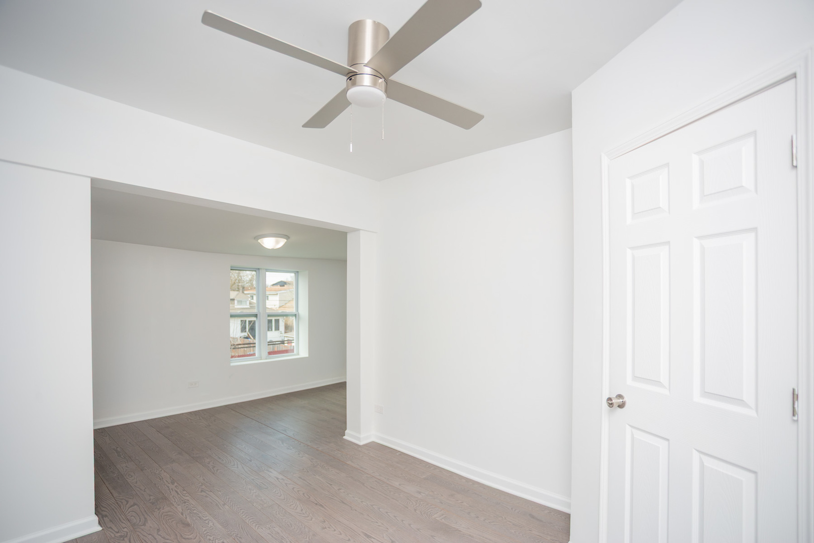 8810 South Morgan Street Chicago, IL 60620 - Photo 10 of 18 an empty room with windows and fan