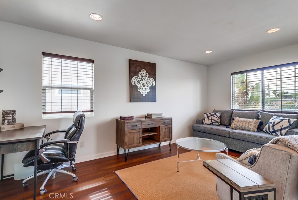 15302 Doty Avenue Lawndale, CA 90260 - Photo 12 of 26 a living room with furniture a rug a lamp and a large window