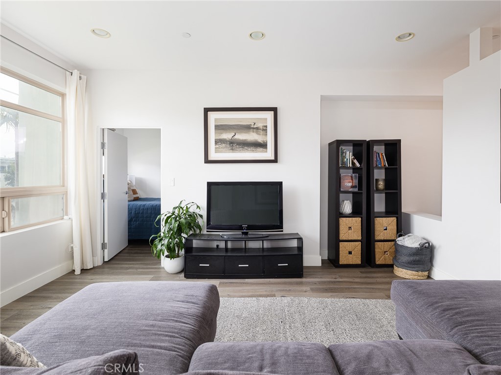 1225 East Grand Avenue, Unit B El Segundo, CA 90245 - Photo 13 of 21 a living room with furniture and a flat screen tv