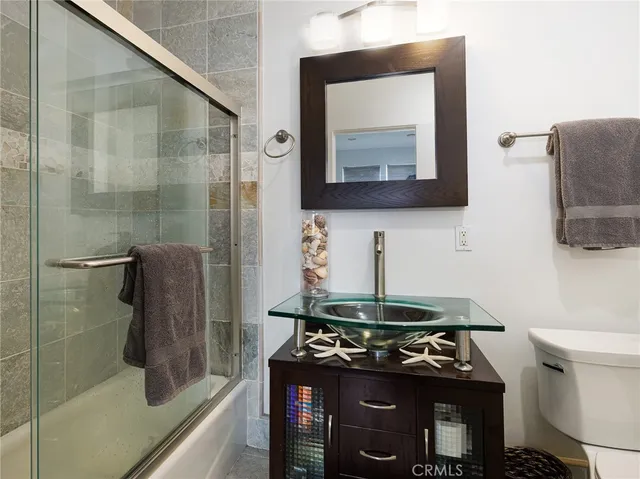 a bathroom with a stove and a mirror