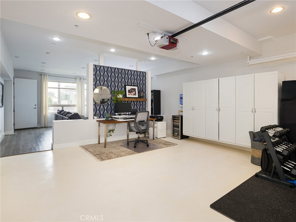 1225 East Grand Avenue, Unit B El Segundo, CA 90245 - Photo 16 of 21 a view of a livingroom with workspace and a large window