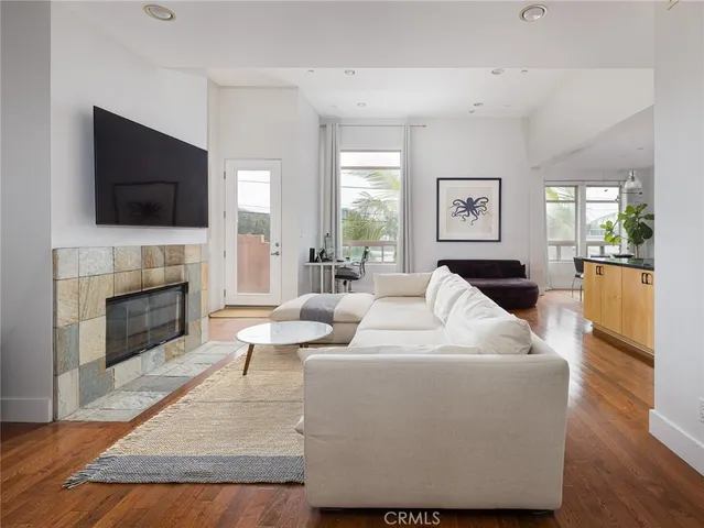 a living room with furniture fireplace and a flat screen tv