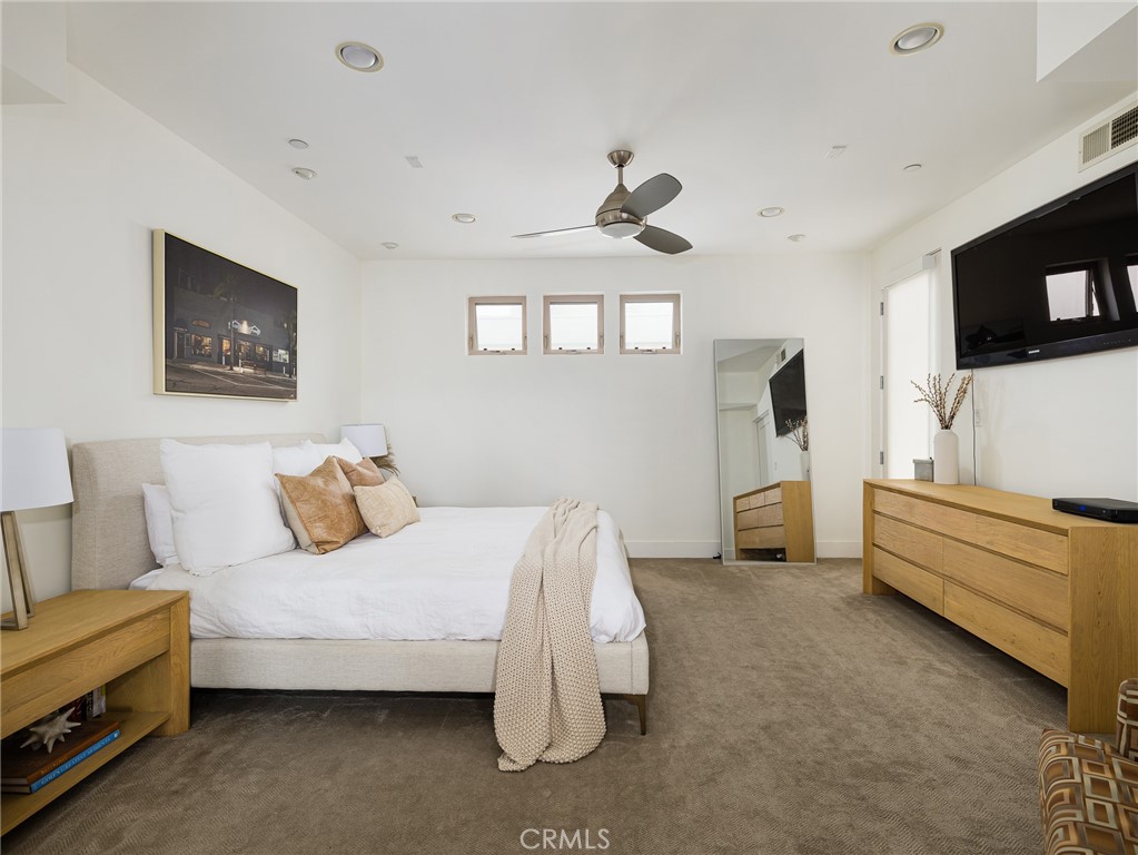 1225 East Grand Avenue, Unit B El Segundo, CA 90245 - Photo 9 of 21 a bedroom with a bed and a flat screen tv