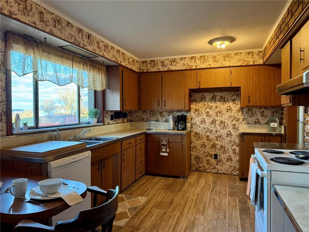119 Pine Run Church Road Apollo, PA 15613 - Photo 7 of 20 a kitchen with stainless steel appliances granite countertop a stove a sink and a refrigerator