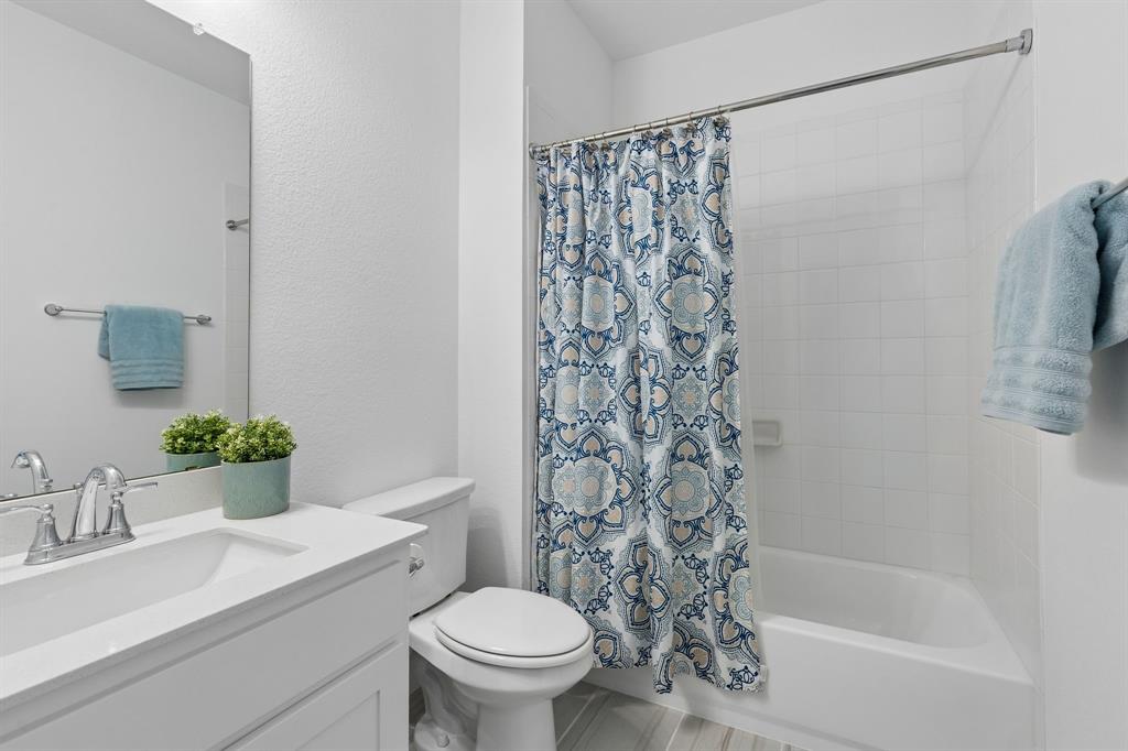 4933 Switchback Street Little Elm, TX 76227 - Photo 18 of 33 Full bath 2, located ensuite to secondary bedroom 4