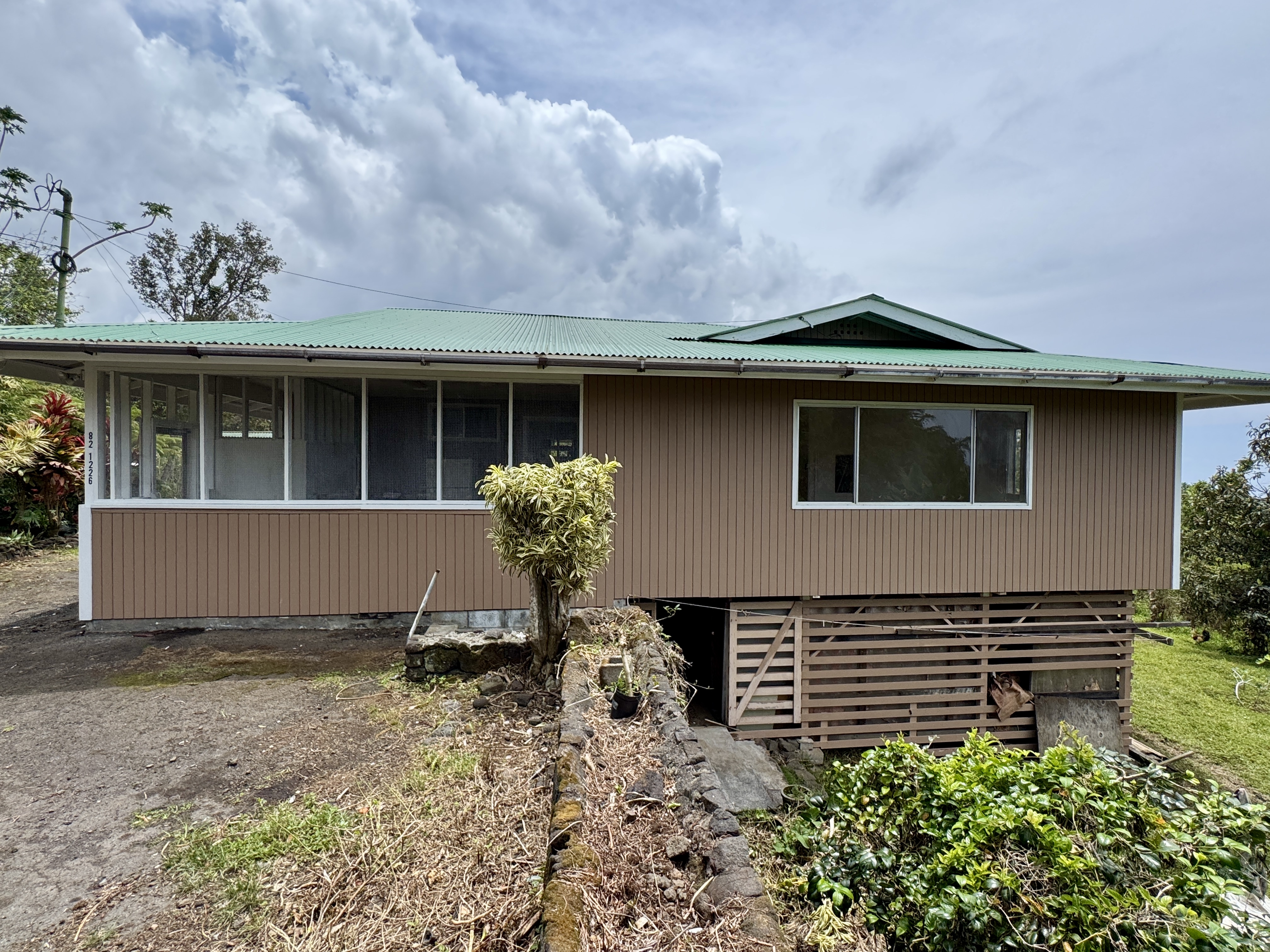82-1226 Kinue Road Captain Cook, HI 96704 - Photo 1 of 28 a front view of a house with garden