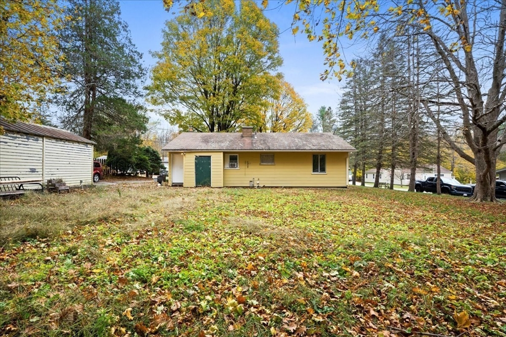 2 Sunset Lane Spencer, MA 01562 - Photo 14 of 37 a front view of a house with a garden