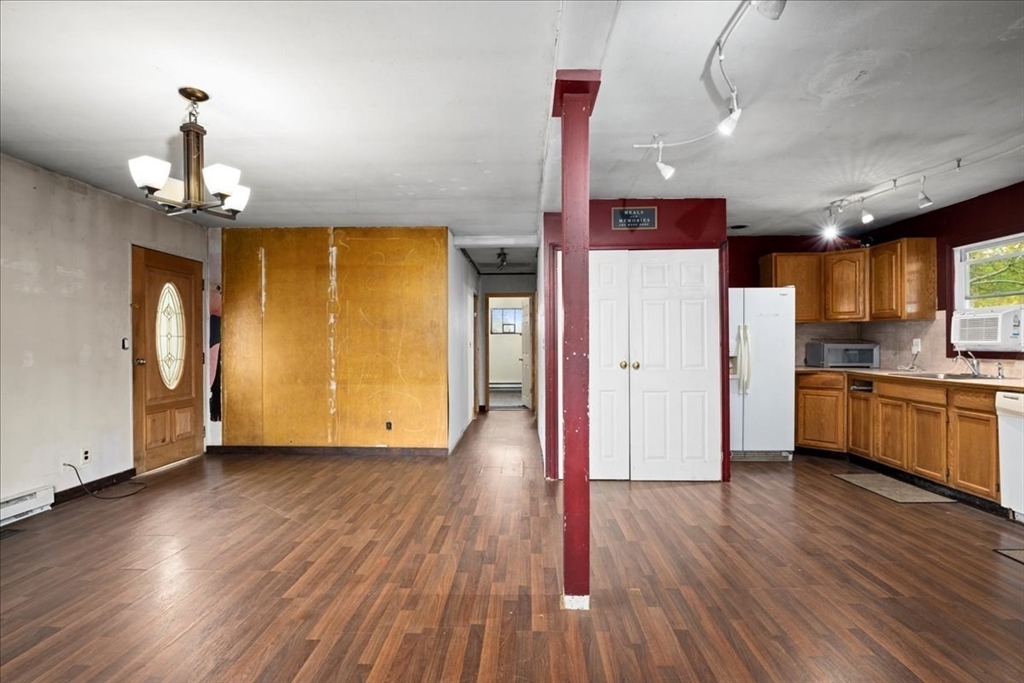 2 Sunset Lane Spencer, MA 01562 - Photo 29 of 37 a view of a kitchen with a refrigerator wooden floor and a sink