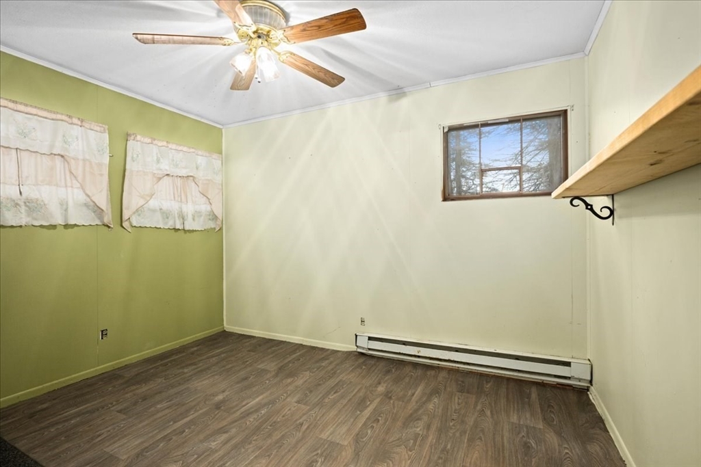 2 Sunset Lane Spencer, MA 01562 - Photo 34 of 37 an empty room with windows and fan