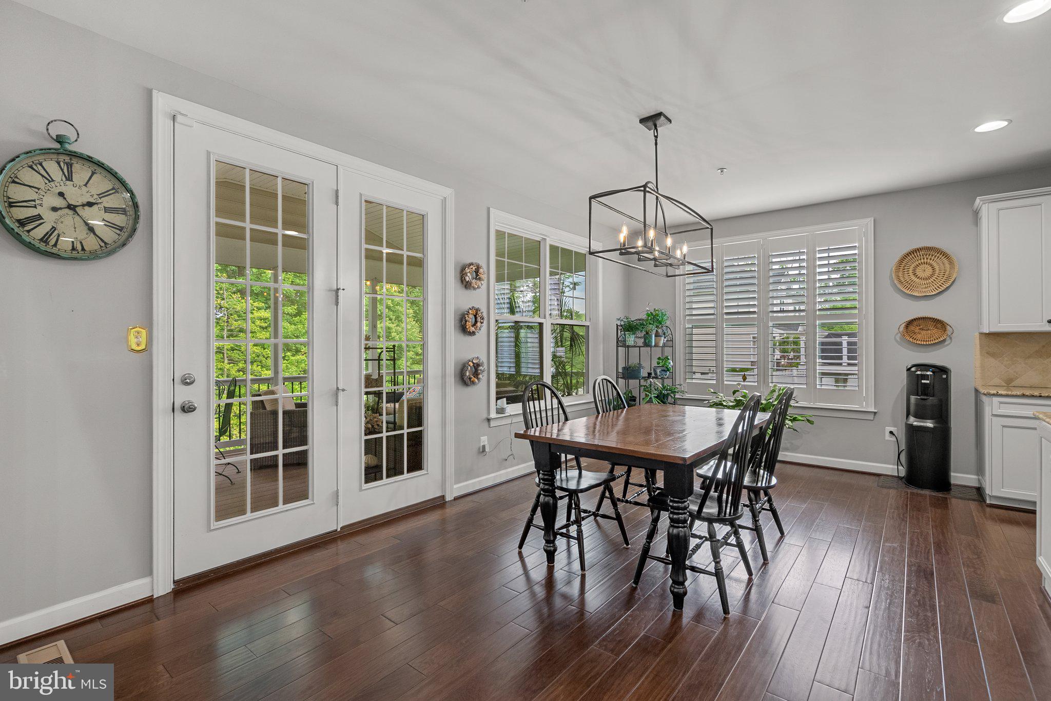 161 Moore Road Arnold, MD 21012 - Photo 12 of 57 a view of a dining room with furniture window and wooden floor