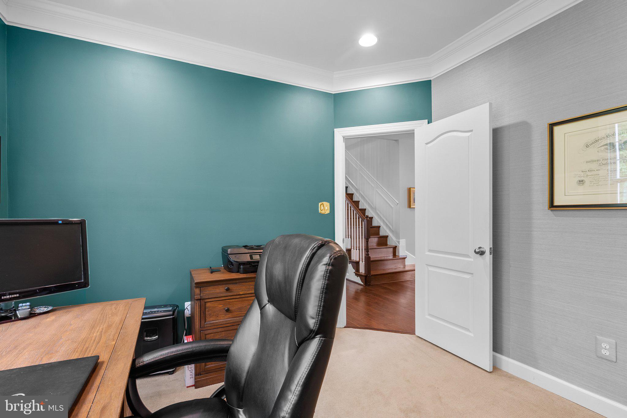 161 Moore Road Arnold, MD 21012 - Photo 19 of 57 a view of a workspace with furniture and a flat screen tv