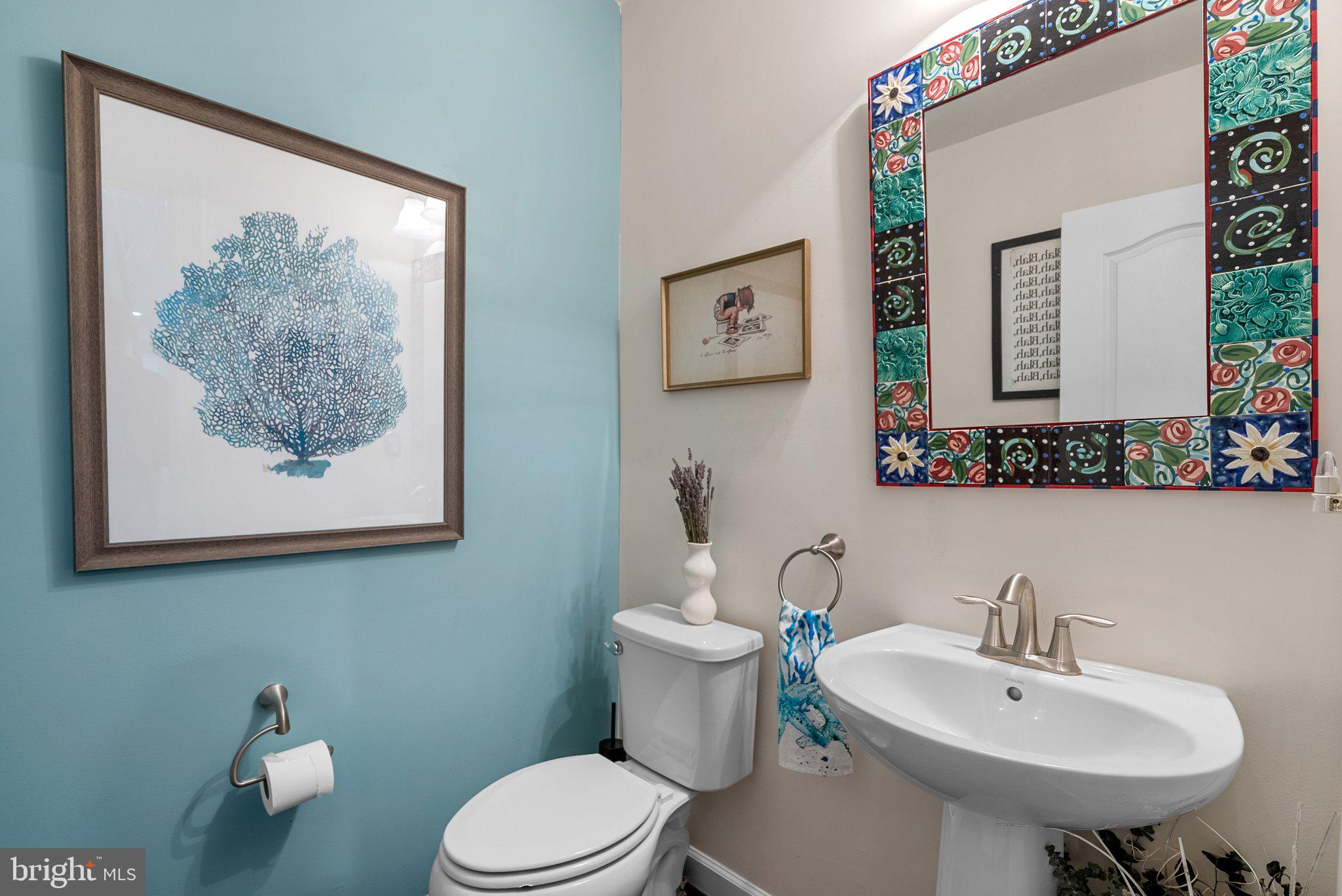 161 Moore Road Arnold, MD 21012 - Photo 20 of 57 a bathroom with a toilet a sink and a mirror