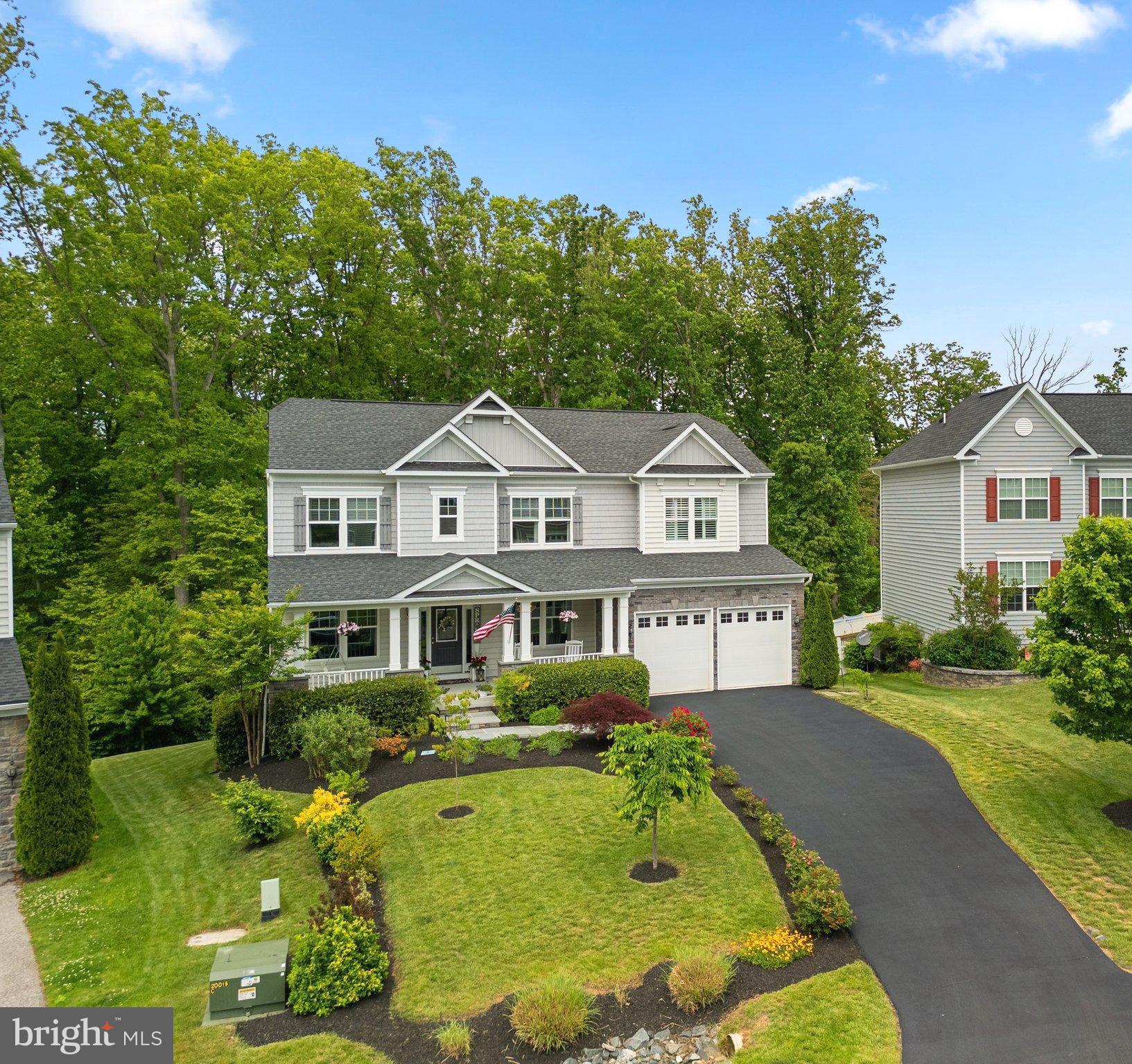 161 Moore Road Arnold, MD 21012 - Photo 2 of 57 a front view of a house with a yard table and chairs