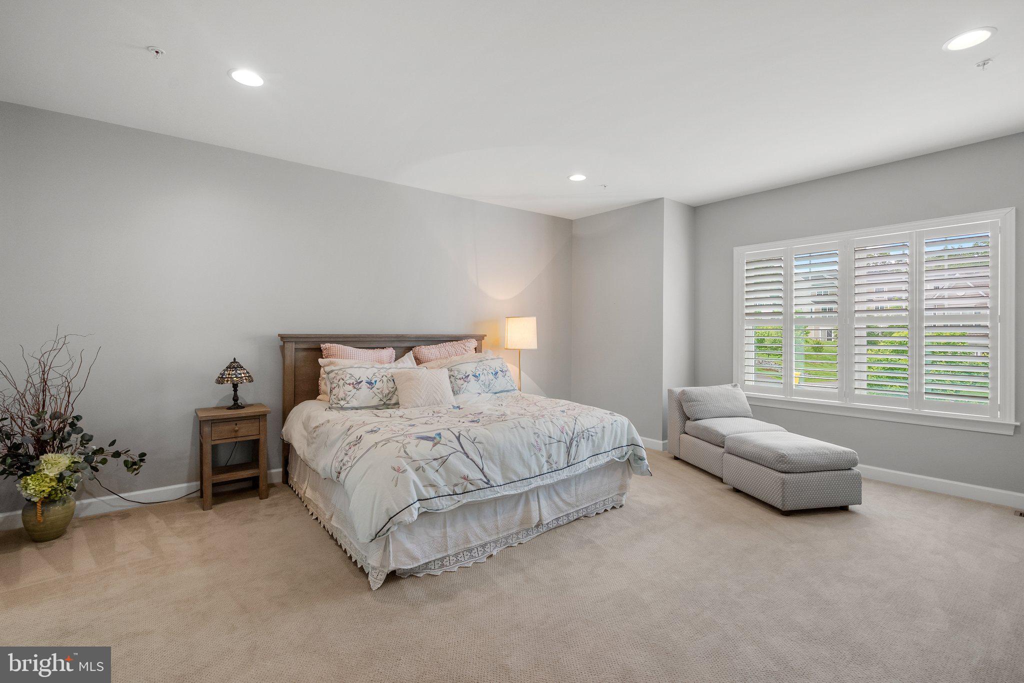 161 Moore Road Arnold, MD 21012 - Photo 24 of 57 a spacious bedroom with a bed and a couch