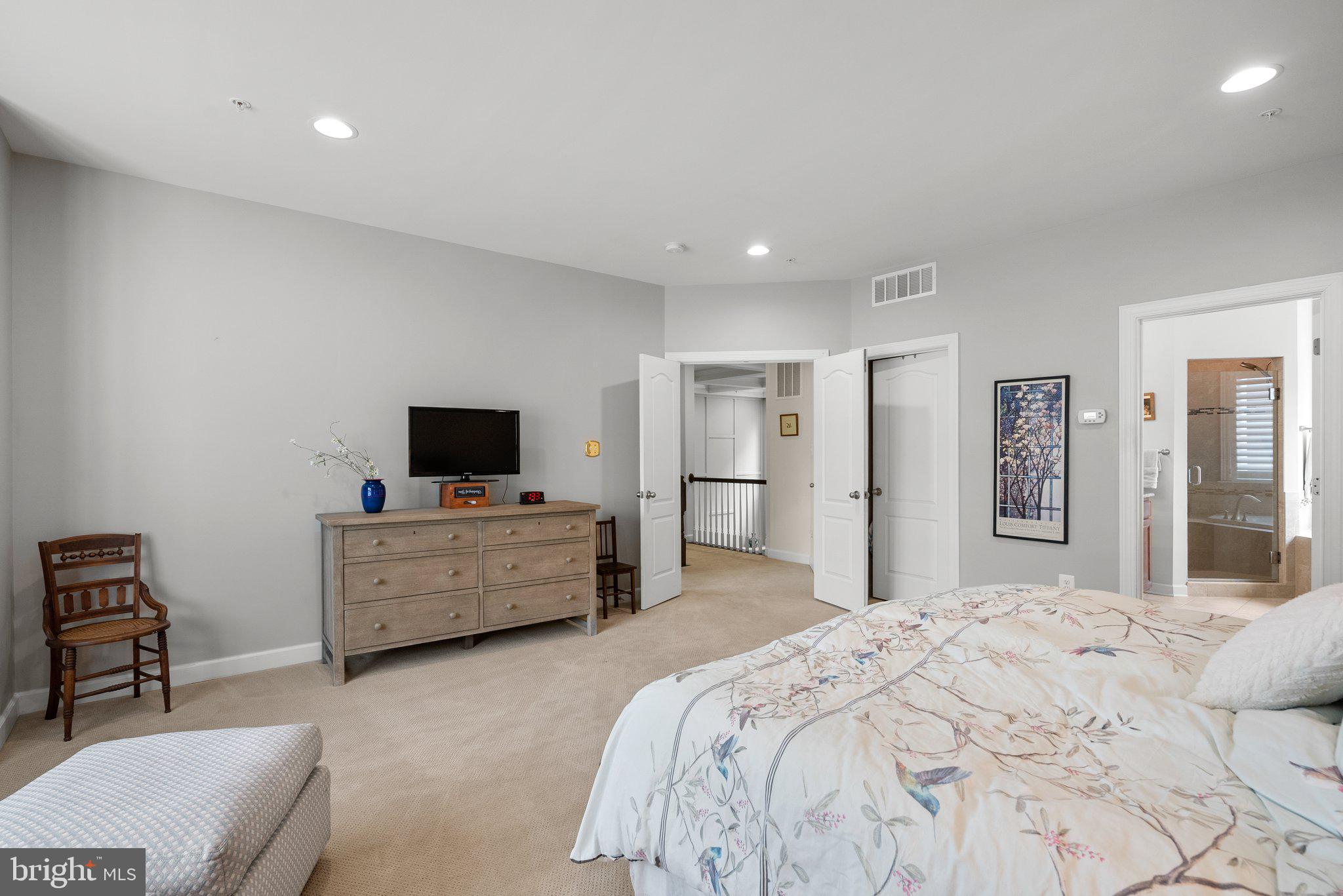 161 Moore Road Arnold, MD 21012 - Photo 26 of 57 a bedroom with a bed and a flat screen tv