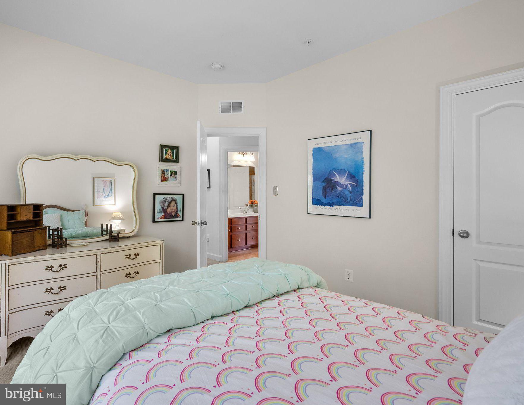 161 Moore Road Arnold, MD 21012 - Photo 30 of 57 a bedroom with a large bed and a chandelier